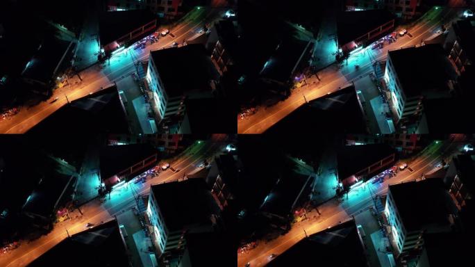 空中夜间照明城市景观泰国路天际线。交通空中全景。夹。夜城明亮的灯光。滑板车