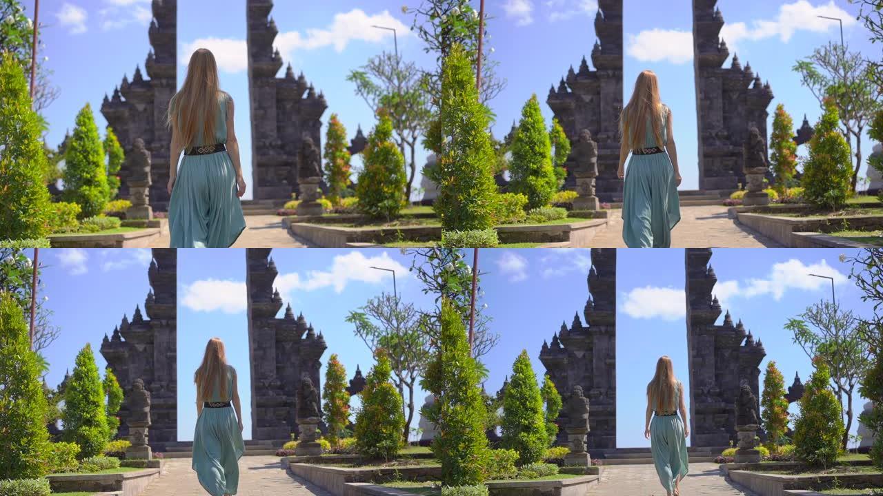 慢动作镜头。年轻女性游客参观印度尼西亚巴厘岛的梵天Vihara Arama寺。巴厘岛旅游概念