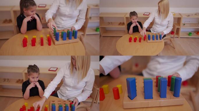 学龄前老师向女孩解释如何玩玩具积木游戏