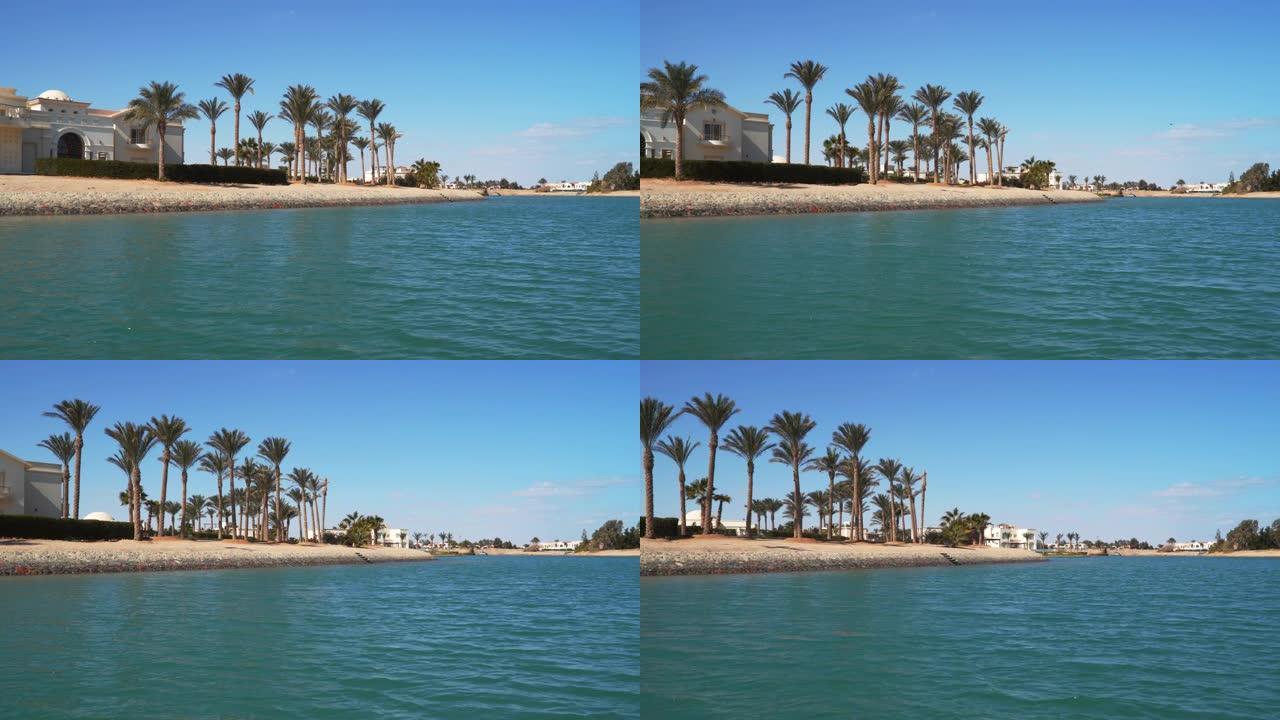 沿着埃及埃尔古纳运河航行的船的景色