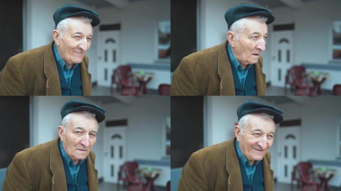 老人养老金领取者的肖像前视图，独自站在户外时穿着夹克和帽子环顾四周