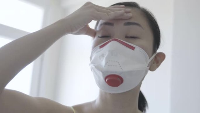 亚洲妇女戴口罩隔离新冠肺炎