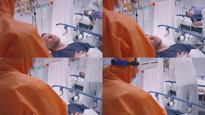 身穿防护服的医生为患有冠状病毒中等倾斜慢动作镜头的患者戴上氧气面罩
