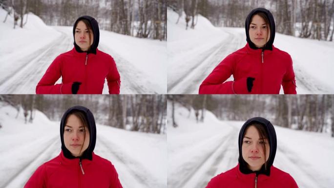 年轻健康的女人在雪地上奔跑