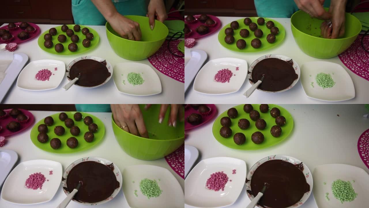 女人做土豆蛋糕。放大工作面。盘子旁边是蛋糕坯料，液体巧克力和彩色洒。