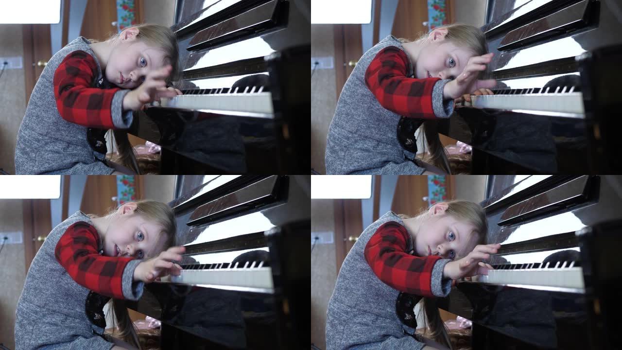 五岁的小女孩厌倦了学习钢琴