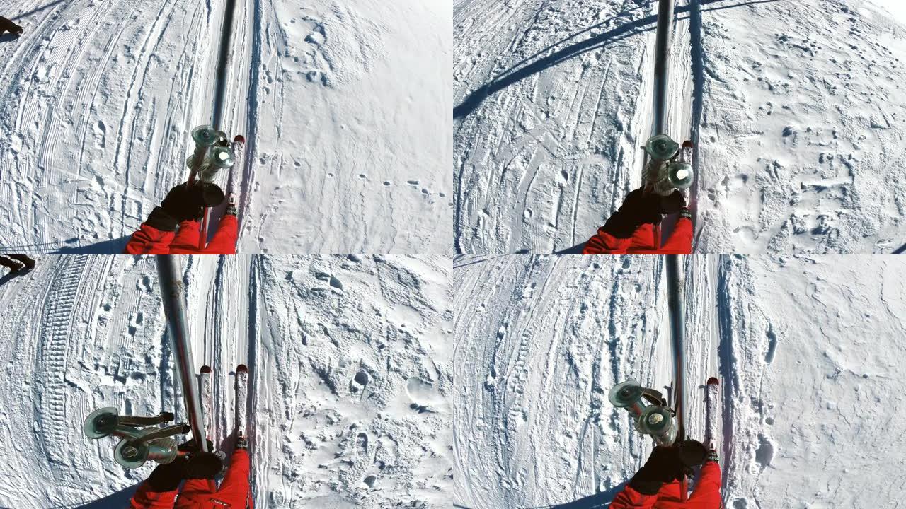 冬季山区拉滑雪缆车上的滑雪者POV