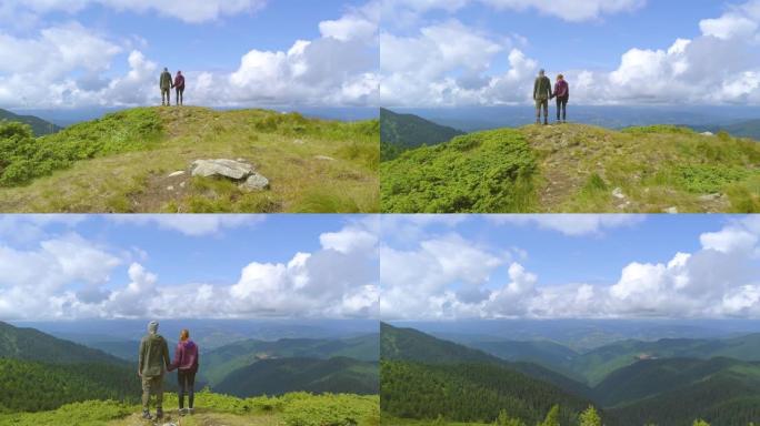 男人和女人站在山上，风景优美