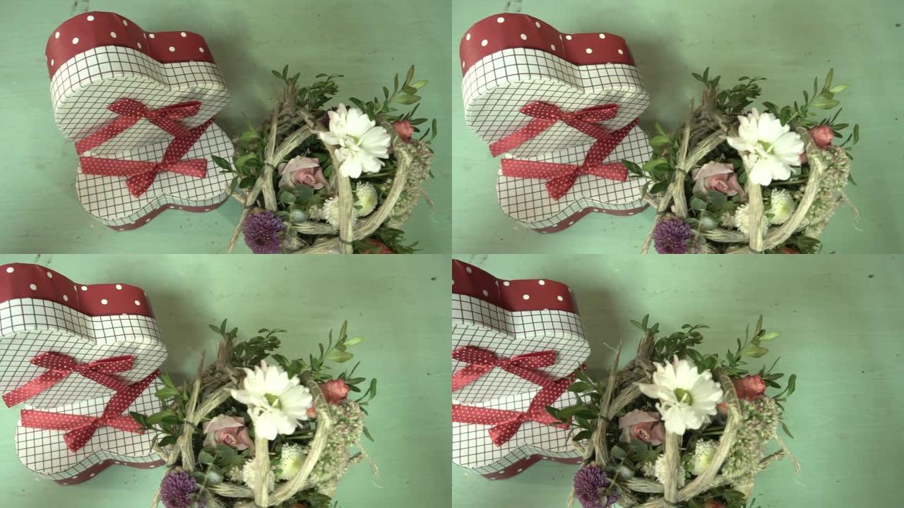 心形和一小束鲜花的礼品盒