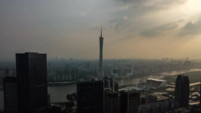太阳光黄昏时间广州市著名的广州塔河湾空中倾斜移动全景4k中国