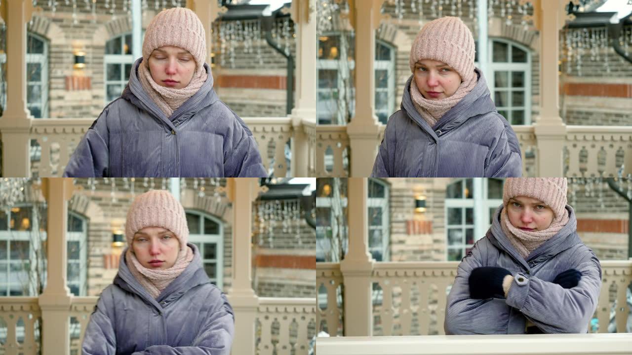 烦恼和愤怒的年轻美女的特写镜头在冬天的户外等待她的男朋友时冻僵了。4K