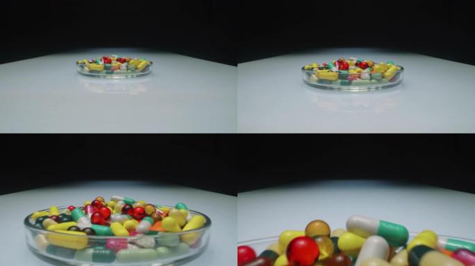 玻璃盘配各种药片和胶囊