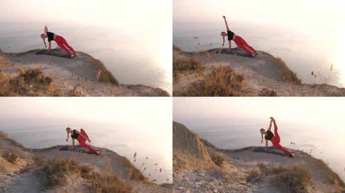 女人在做瑜伽南塔萨纳的美丽景色，在日落时分可以看到海景，在山上侧卧抬腿。