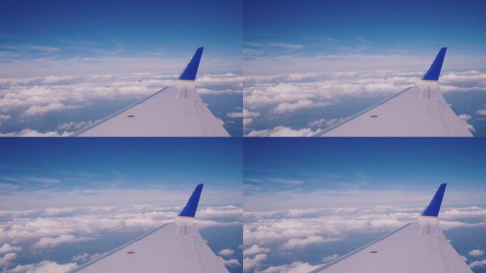 从客机乘客座位到机翼和云层的视图