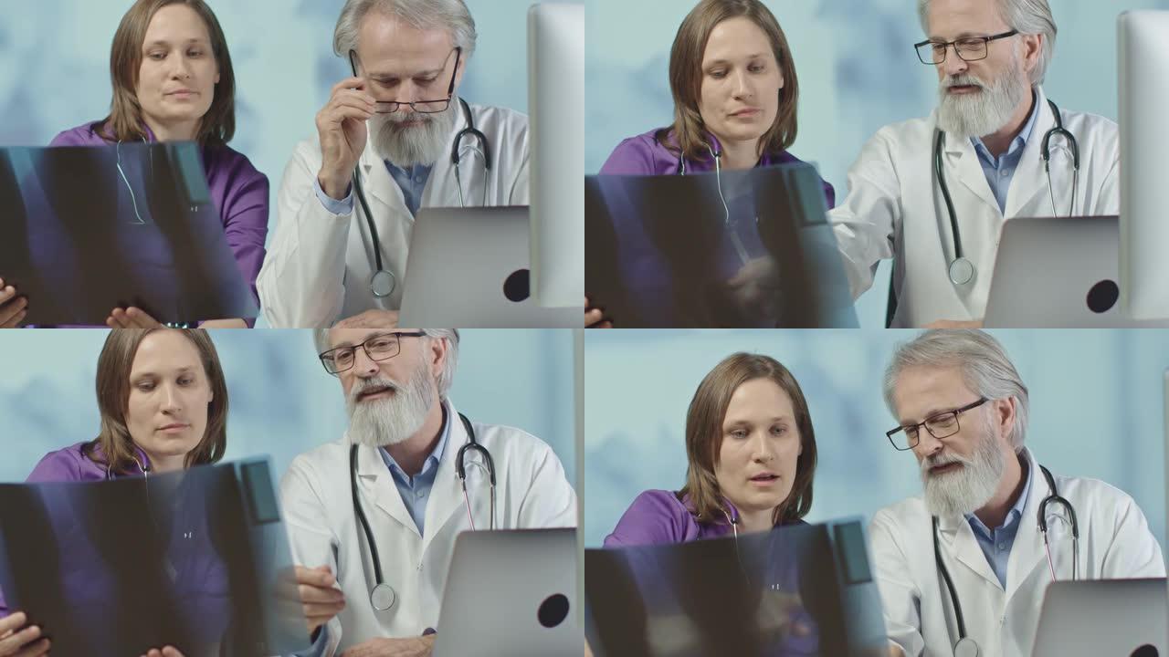 医生和一名护士在医院看x光和ct扫描。中拍，4k慢动作