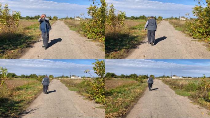 乌克兰农民在告别后在乡间小路上行走
