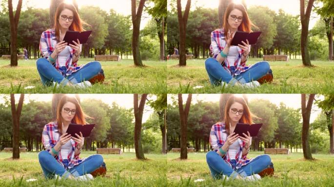 公园里的女人读电子书