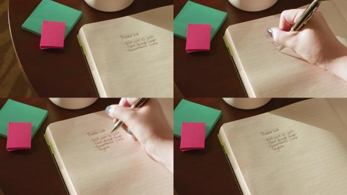 女人在木桌上的日记中写遗愿清单 (旅行，冒险)