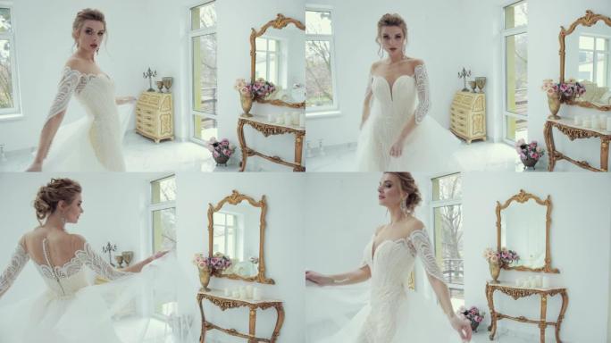 穿着白色婚纱的年轻金发新娘在镜头前摆姿势，转身