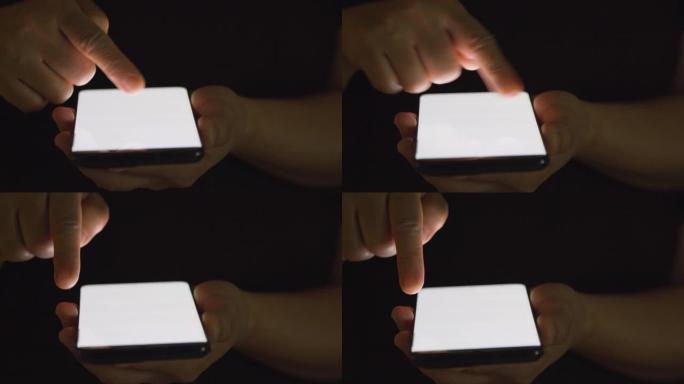 黑暗中手指触摸手机屏幕
