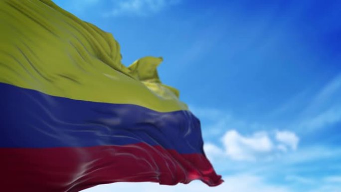 哥伦比亚国旗以4k分辨率在蓝天上缓慢挥舞