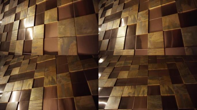 金色方块背景。抽象3D金色金属立方体。墙壁用金、铜或金属砖、盒子。在红龙电影摄像机上拍摄。