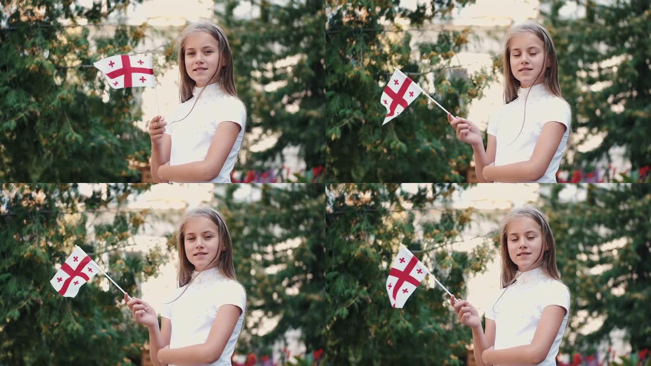 站在外面的小女孩举着格鲁吉亚国旗