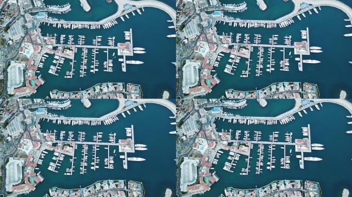 塞浦路斯利马索尔码头的俯视图。豪华游艇和船只停靠，无人机镜头