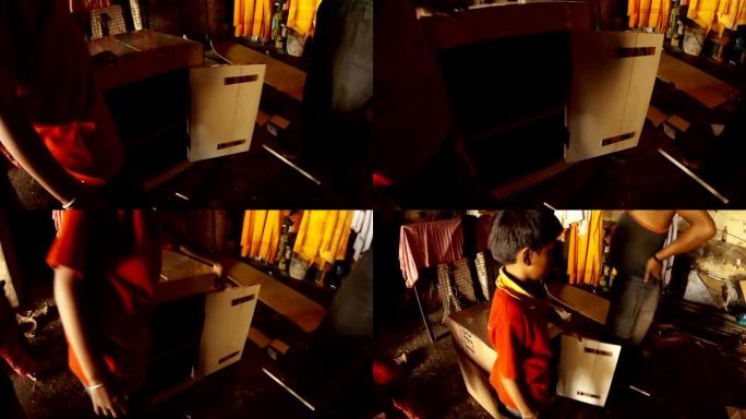 印度男孩在瓦拉纳西贫民窟附近打开和关闭床头柜疾病