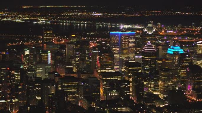 蒙特利尔魁北克航空v112在夜间平移市中心低空飞行，城市景观