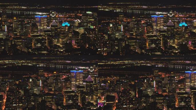 蒙特利尔魁北克航空v112在夜间平移市中心低空飞行，城市景观