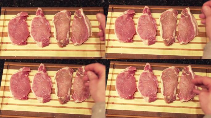 自上而下的视图，将粗盐未煮熟的生去骨里脊肉猪排新鲜放在准备烧烤的木制砧板上