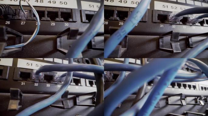 电缆管理插入闪烁的网络交换机中的Cat5e以太网电缆，在信息技术网络壁橱的后台使用纠结的凌乱的高速互