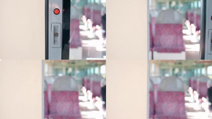 一只手的特写按下地铁列车门的按钮。