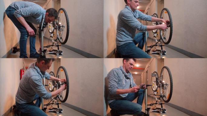 一名男子用空气给自行车车轮打气。