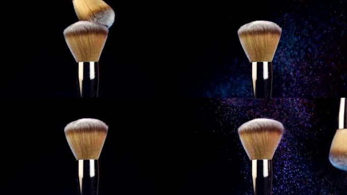 黑色背景上有美丽粉末爆炸的化妆刷