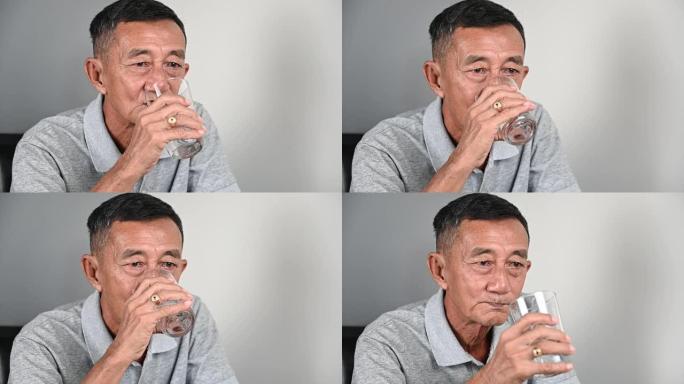 4k亚洲老人饮用水肖像。Hapiness和helthy肖像概念。helthy老人肖像慢动作。