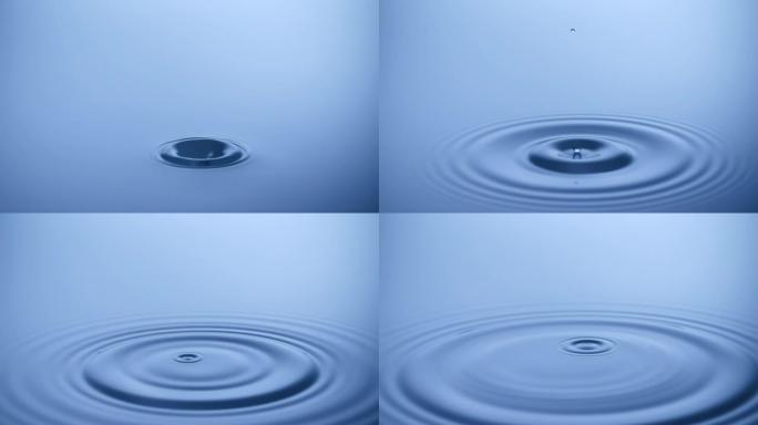 慢动作水滴溅入平静的水中-使用超高速相机拍摄