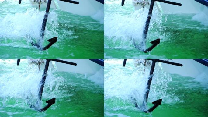 移动摩托艇在海面上滑动的锚的详细视图。漂浮在海湾上的快速游艇溅出清澈的水。帆船在海洋中旅行的特写。暑