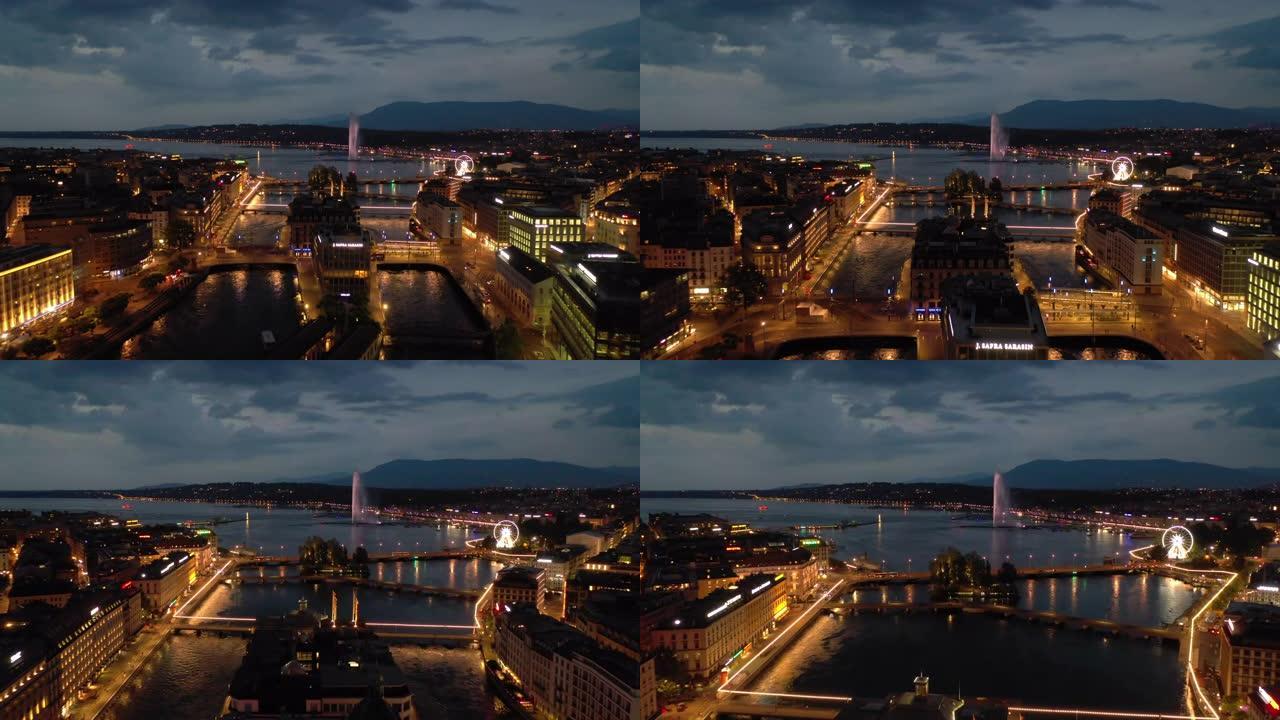 夜间照明飞行在日内瓦市中心湖滨交通河湾空中全景4k瑞士