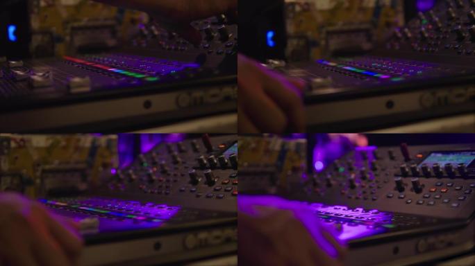 在夜总会使用音频混音在音响工程师hand的特写镜头