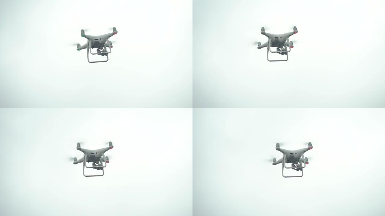 白色的四轴飞行器逆天飞入相机。