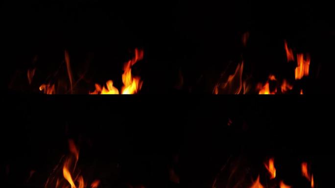 黑暗背景上的火焰热烈火苗跳动