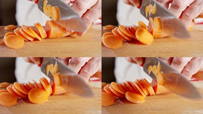 厨师刀切成胡萝卜的慢动作特写