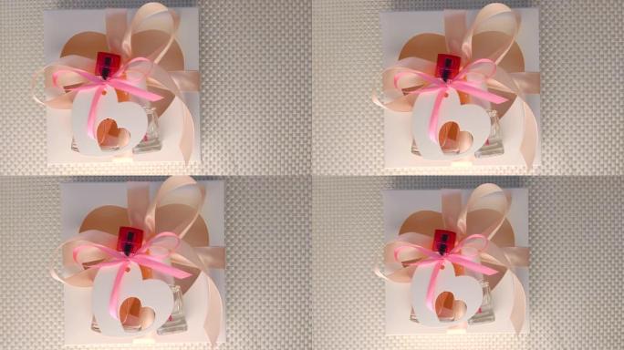 情人节创意概念公寓。礼品盒模型，粉色香水瓶，白色背景上的缎带指甲油
