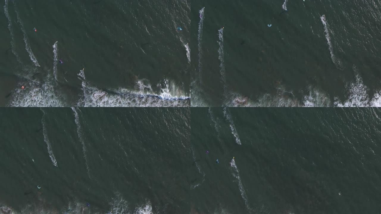 自上而下的空中无人机在海浪上拍摄风筝冲浪者和风帆冲浪者 (加利福尼亚州太平洋海岸公路Waddell 