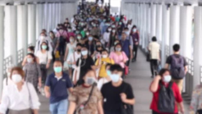 人群戴口罩以保护corovvirus或新型冠状病毒肺炎爆发。