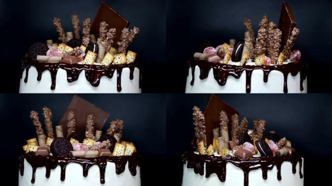 旋转美丽的蛋糕，装饰巧克力浇头和糖果。