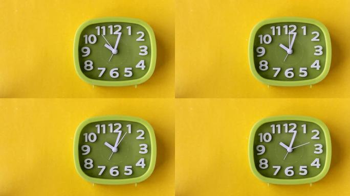绿色时钟，白色数字和箭头隔离在黄色背景上，实时