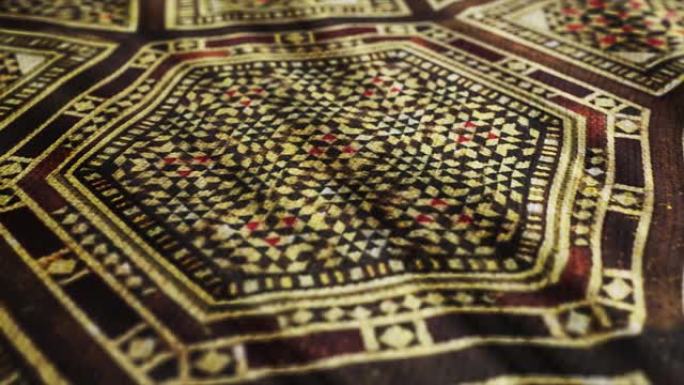 织物布与传统的伊斯兰，亚洲图案宏观特写镜头与pan运动。奥斯曼的设计，复古东方桌布。